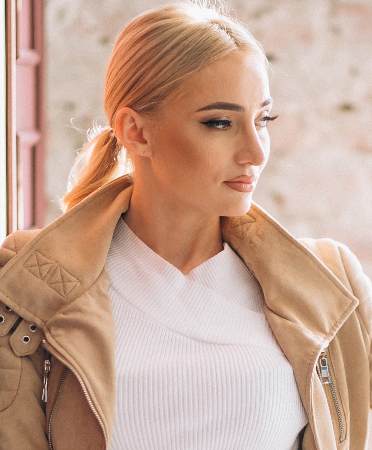 Close-up of a woman's face with flowing hair.