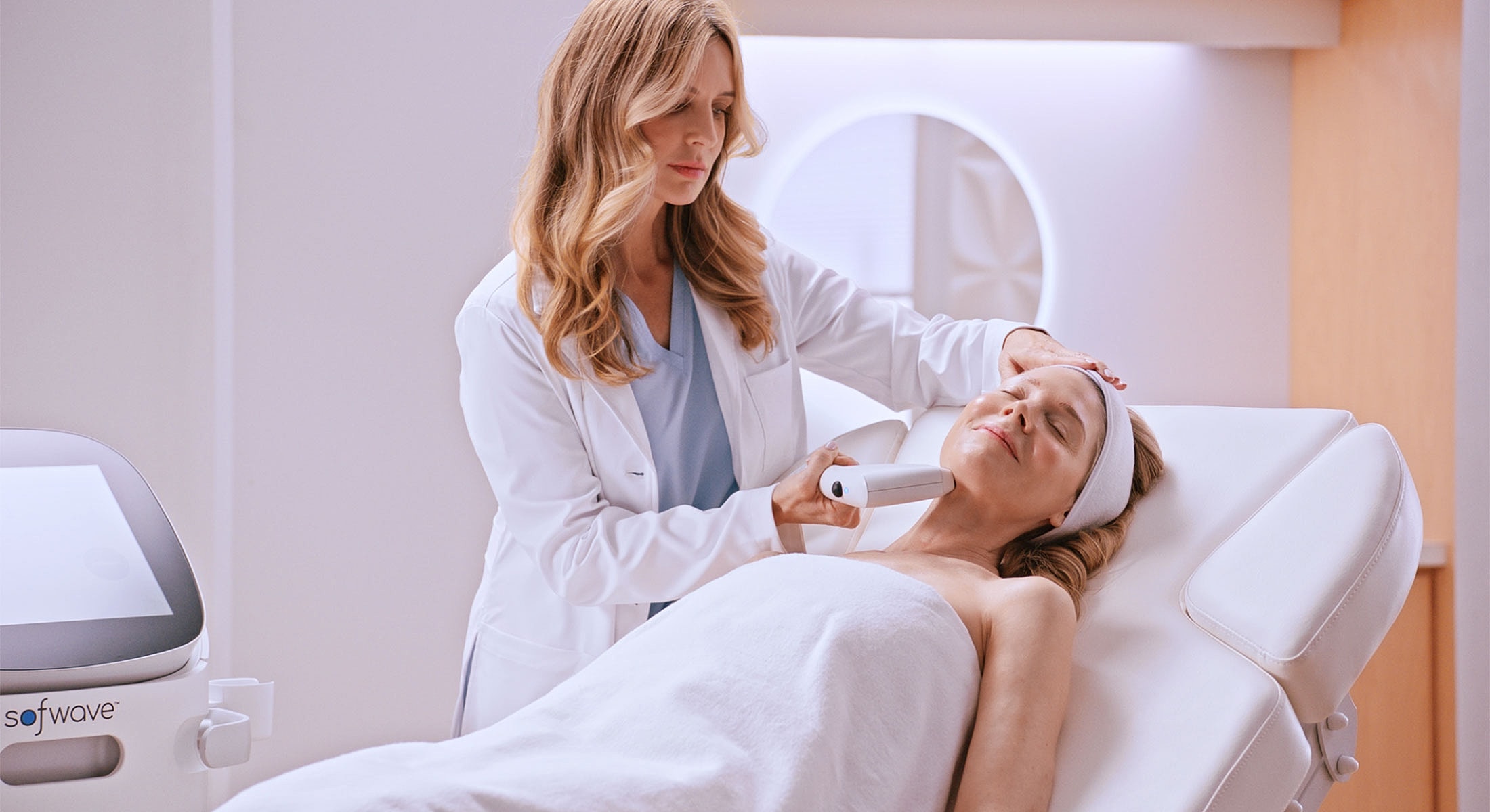 Woman receiving facial treatment in a clinic.