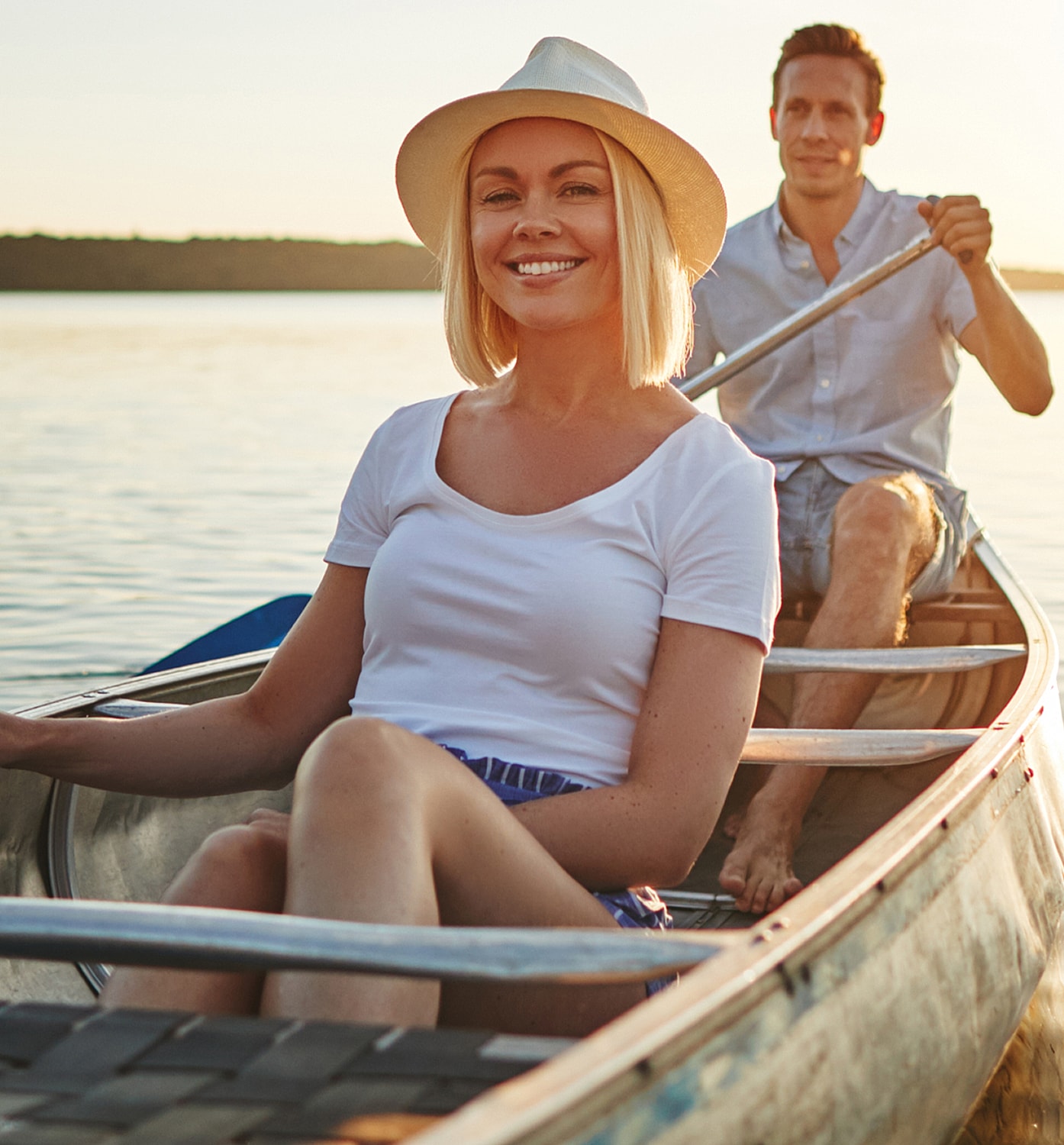 Woman with long hair in neutral-toned outfit.